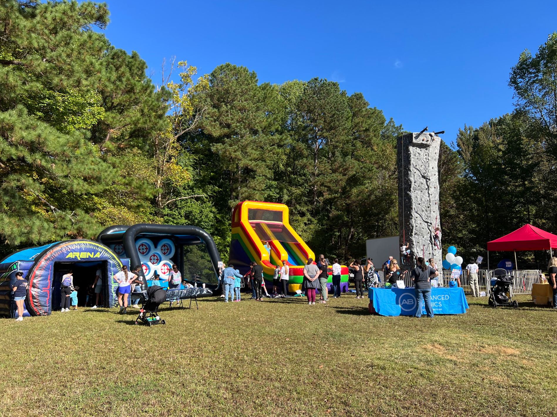 Inflatable games and a climbing wall set up at Camp Woodbine