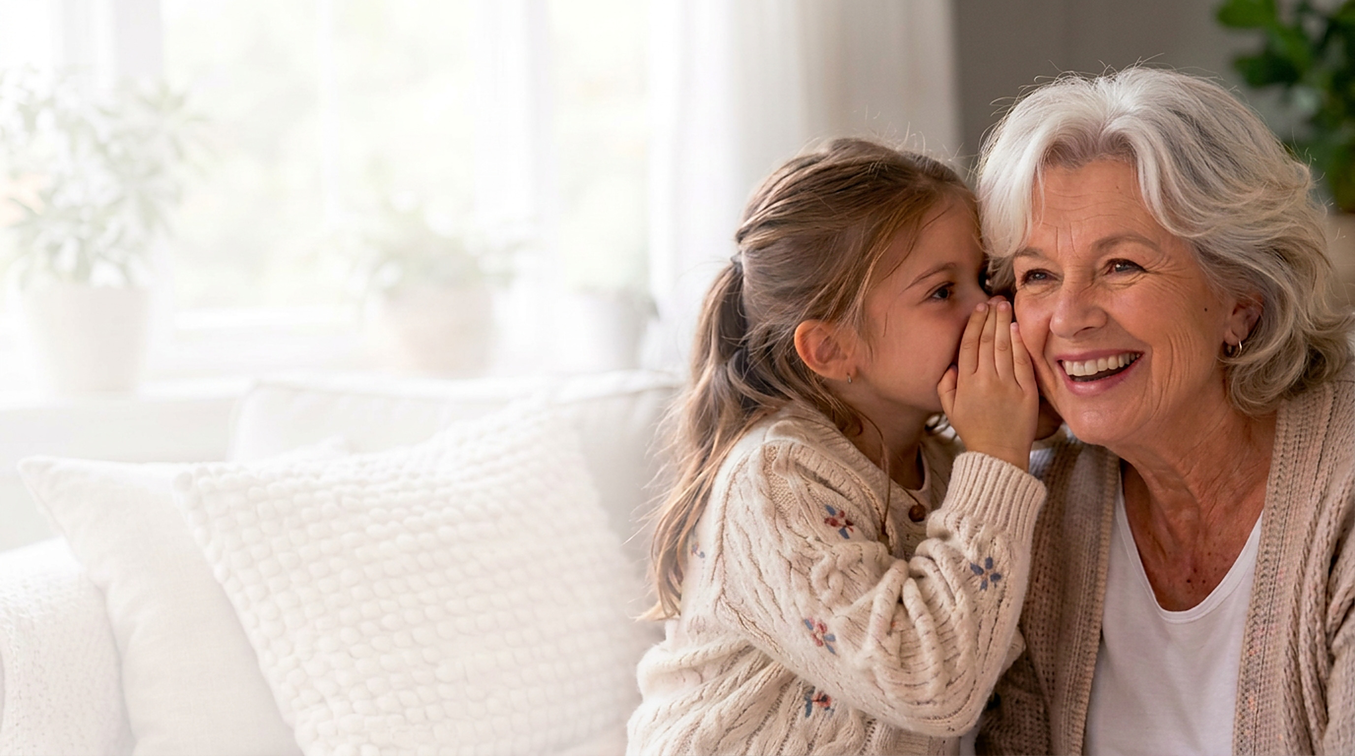 A grandmother and granddaughter sharing a whispered secret